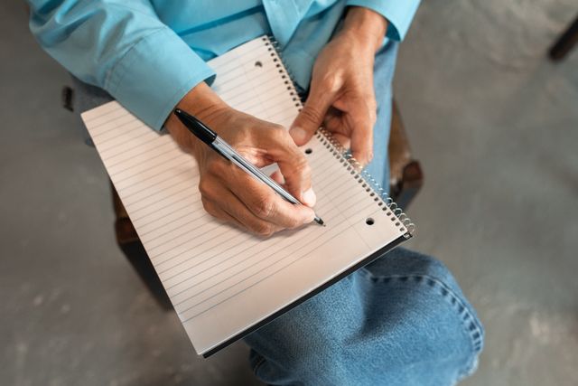 a person prepared to take notes